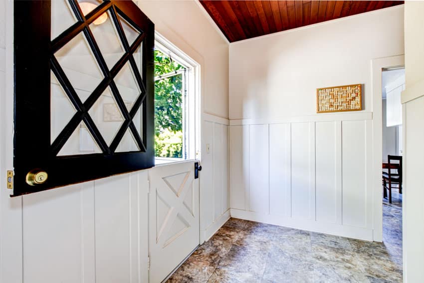 House entrance with dutch door, and wood ceiling
