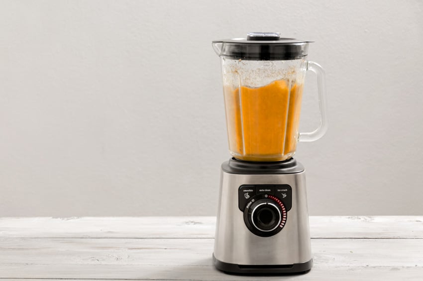 Orange smoothie in a blender