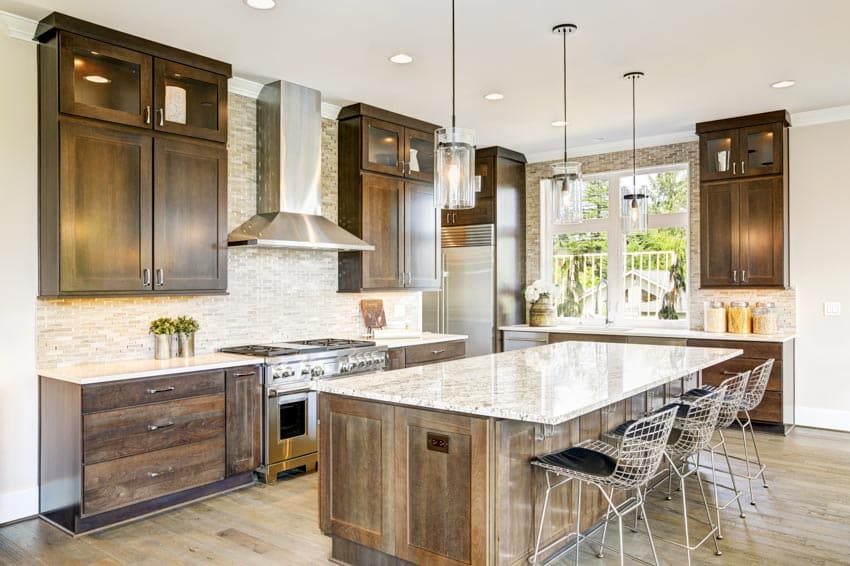 Kitchen with wood cabinets, island and countertops