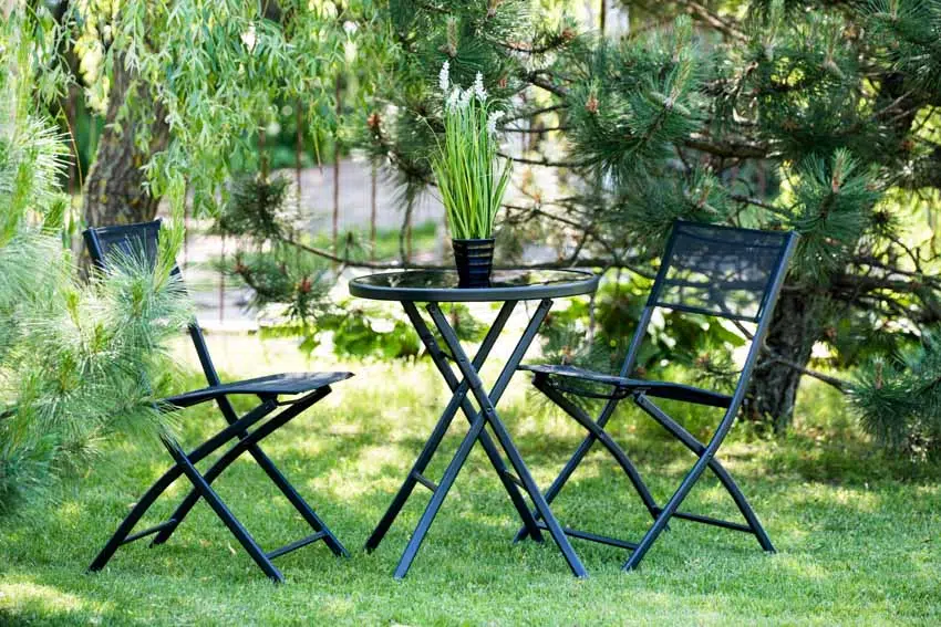 Lightweight table and chair used as outdoor furniture on grass