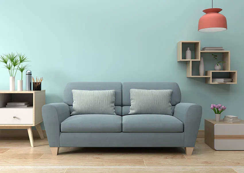 Living room with aqua painted walls blue gray sofa