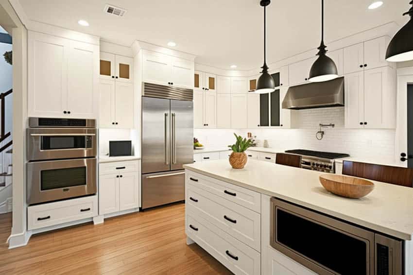 Modern farmhouse kitchen white cabinets microwave in island black fixtures