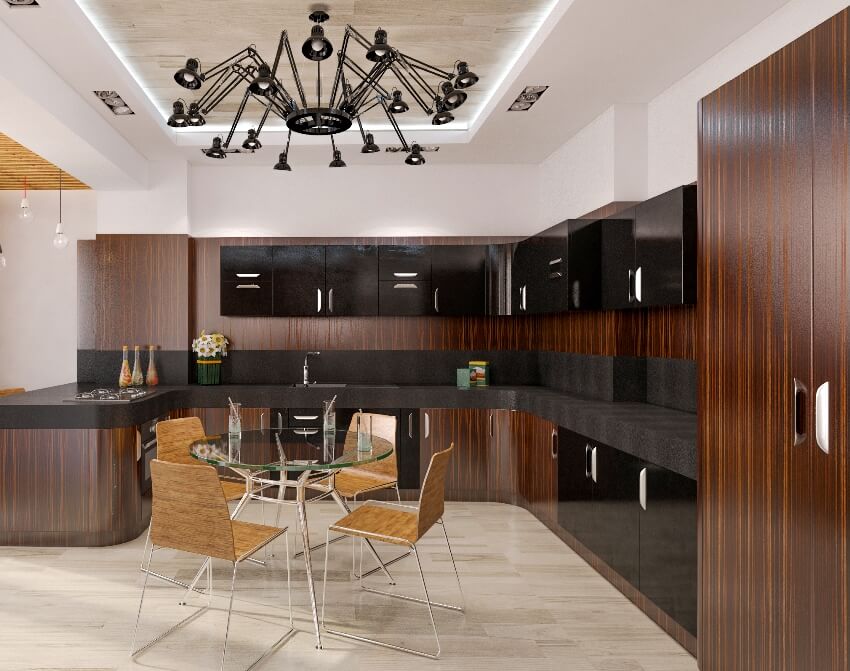 Modern kitchen design with black and dark wood teak cabinets, dining set and black modern chandelier
