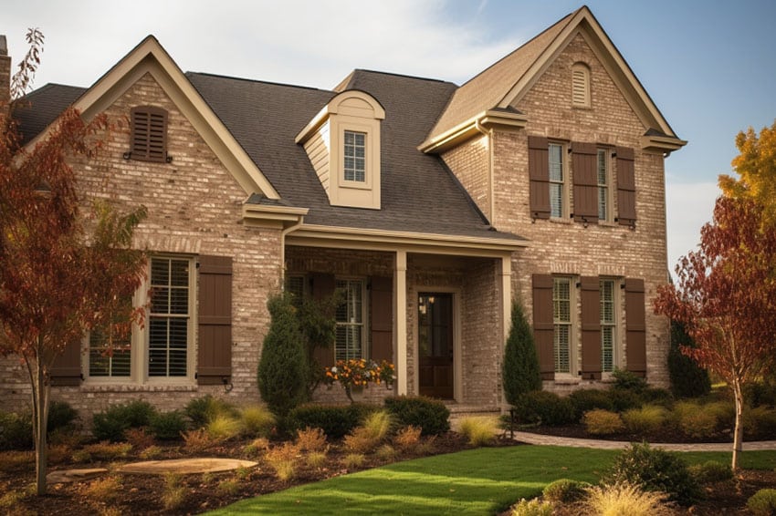 House tan color dark brown shutters