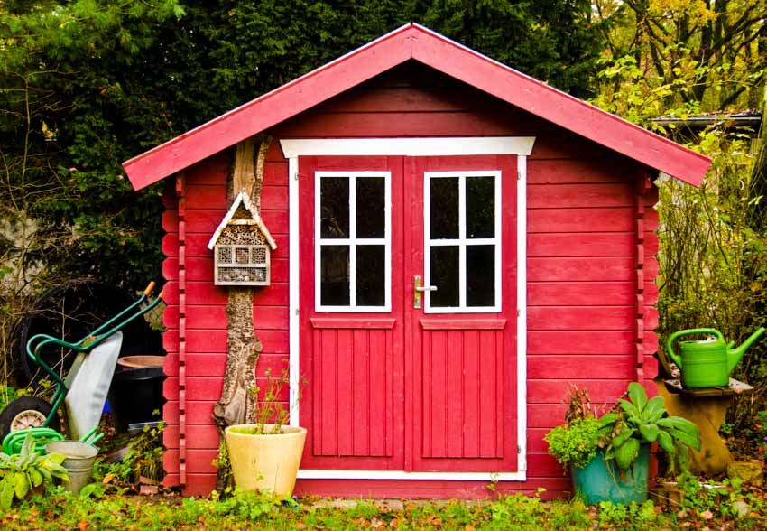 New England shed with red paint and double doors