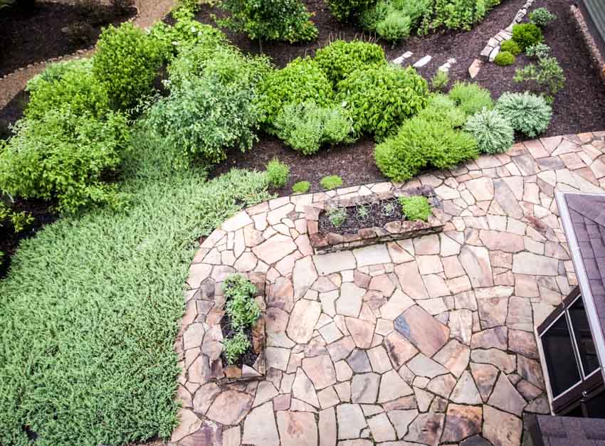 Flagstone pavers, plants, and flowers