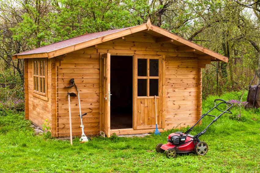 Outdoor shed made of wood and organized with tools and gardening items
