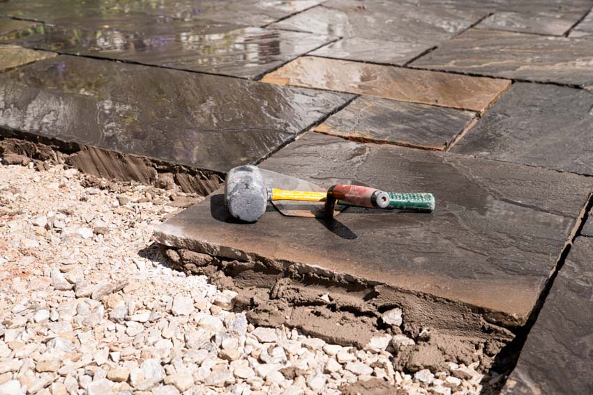 Flagstone pavers being removed