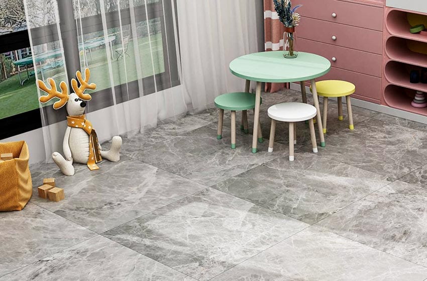 Playroom with table, chairs, and peel and stick stone look floor tiles