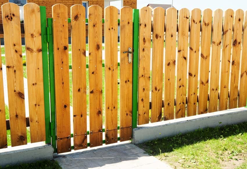 Pressure treated fence with gate for outdoor areas