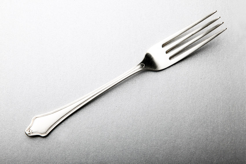 Silver serving fork for dining purposes