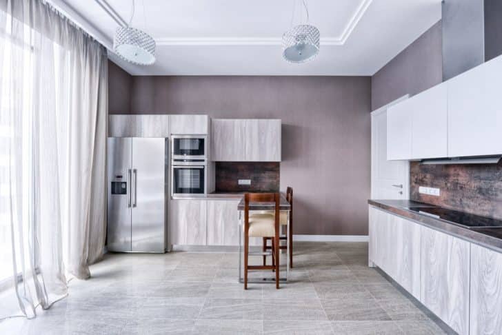 Simple Kitchen With Ceiling Lights Backsplash Countertop Refrigerator Range Hood Cabinets And Stone Look Vinyl Flooring Ss 728x486 