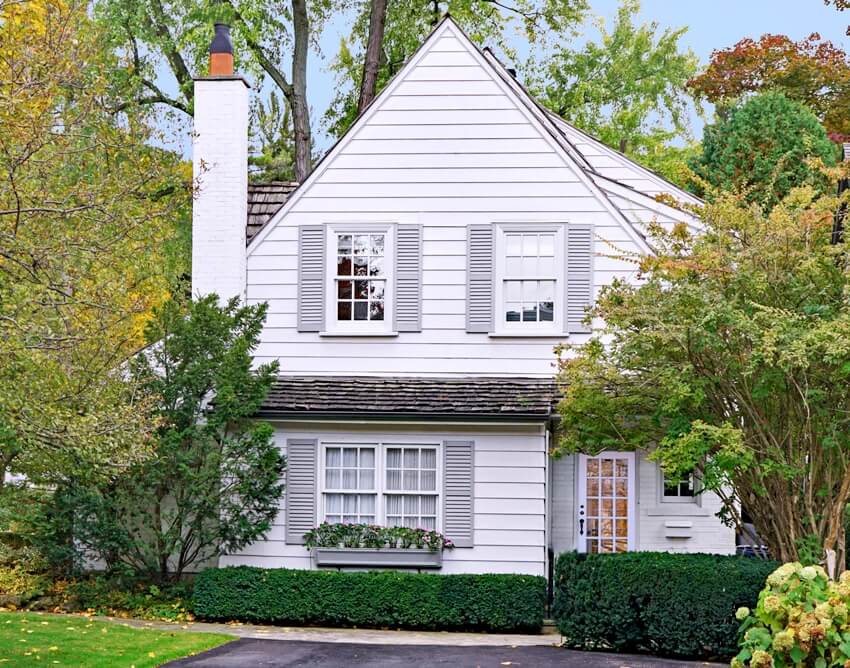 A small white house with gray trim