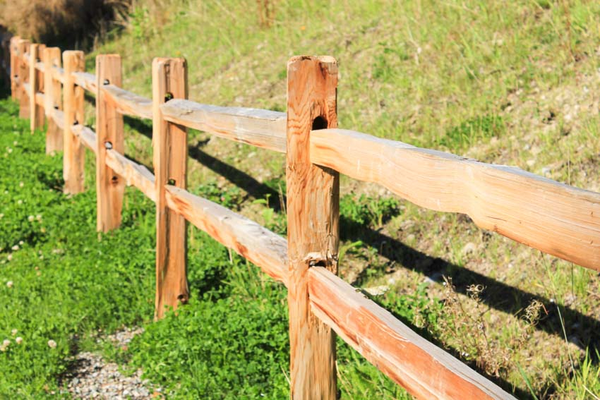 Split rail fence made of wood for house exterior areas