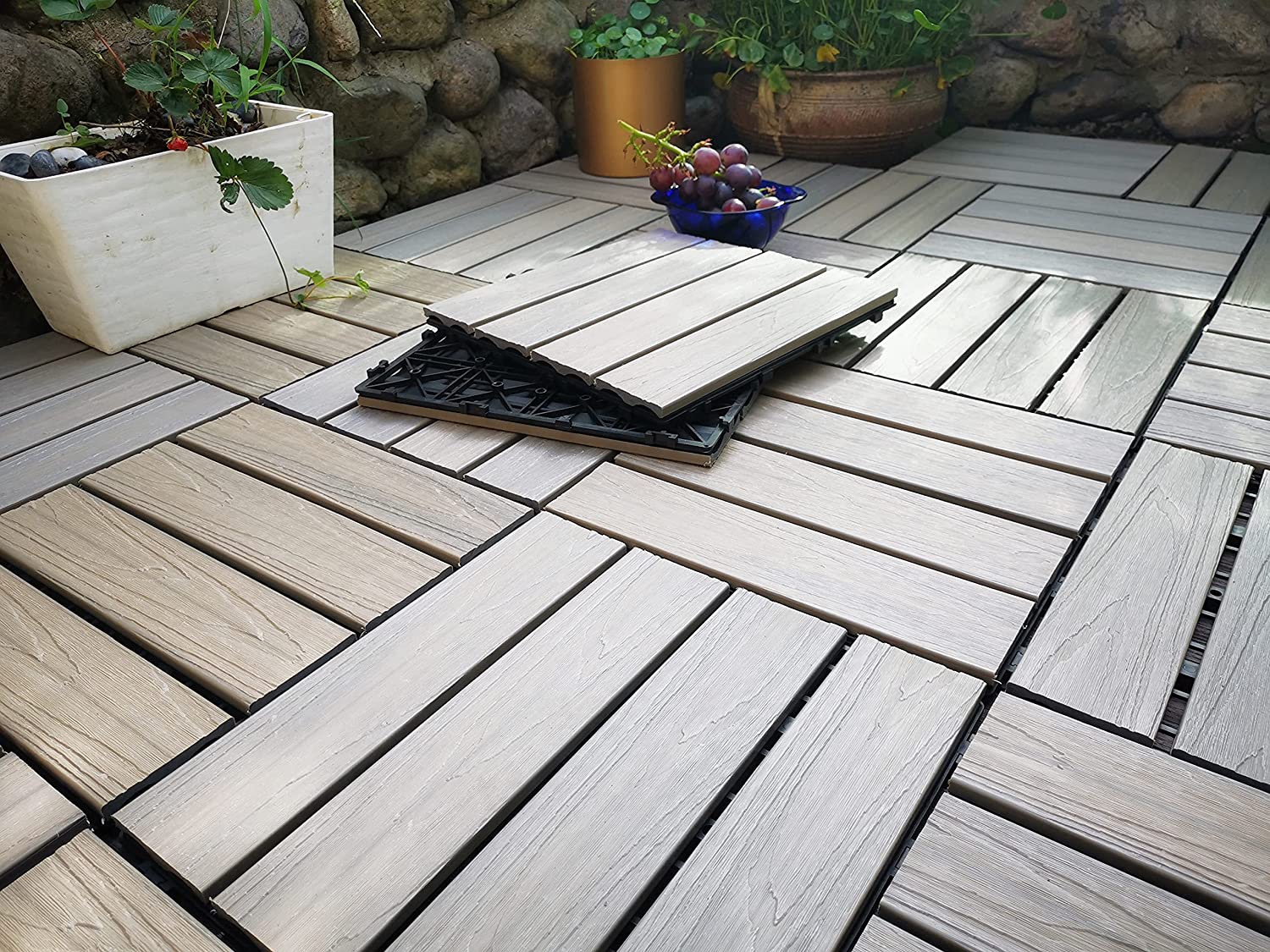 Temporary interlocking floor tiles for outdoor areas with grass