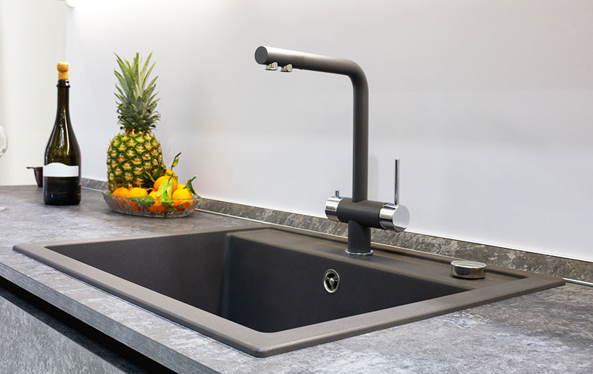 Black granite composite sink with single handle faucet