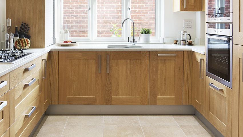 Kitchen with vinyl wrap cabinets wall oven French windows