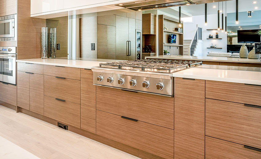 Modern kitchen with high end cabinets vinyl door wraps big stove mirror backsplash built in oven