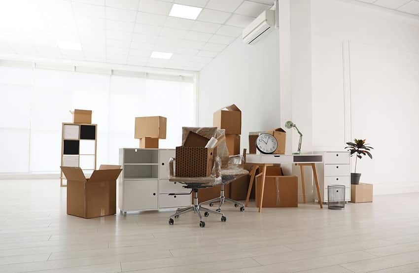 Office chairs, tables and things in boxes