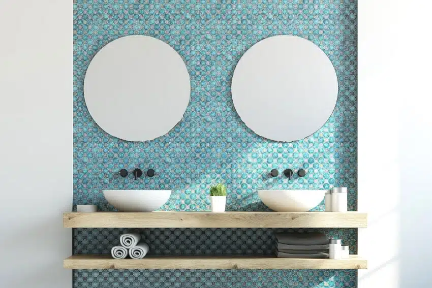 Bathroom interior with a double sink on a wooden shelf two round mirrors 