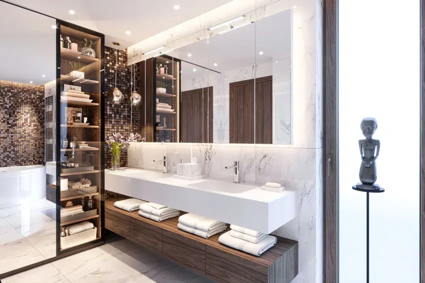 Bathroom with marble backsplash, floating sink and frameless mirror