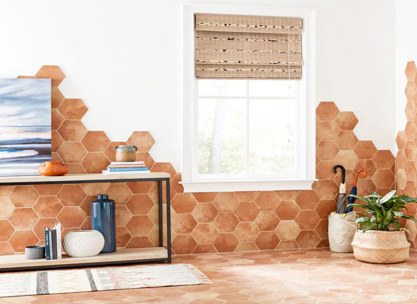 Bathroom with hexagon Saltillo tile floors and walls, window, roman shade, and indoor plant