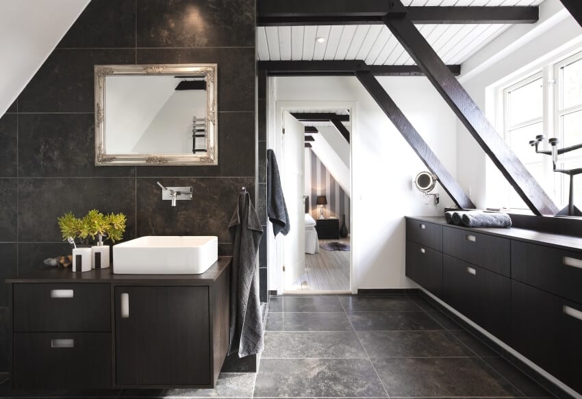Bathroom with structural beams, shiplap ceiling, dark wood cabinets, and granite tiles