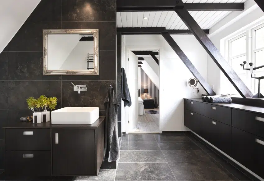 Bathroom with structural beams, shiplap ceiling and dark wood cabinets