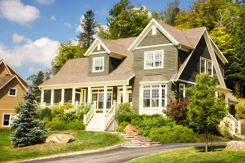 Beautiful green and brown toned exterior with dormers