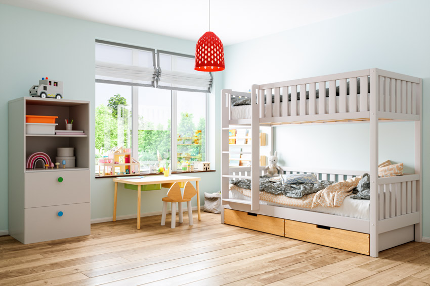 Bedroom with bunk bed, desk, chair and wood floor