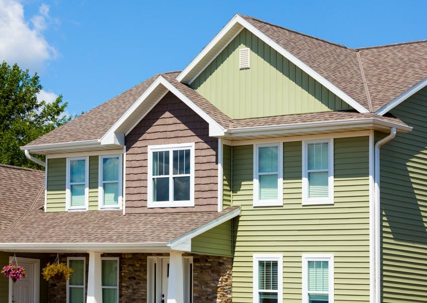 Brown and green house with siding