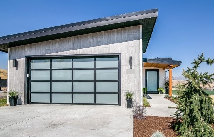 Contemporary Modern Home With Concrete Driveway And Garage Door With Frosted Glass Is 728x467 
