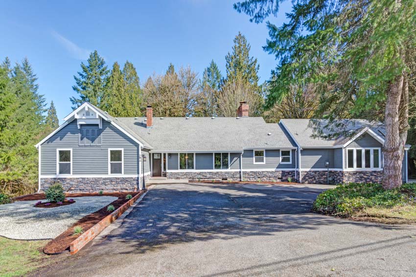 Contemporary home with blue siding and driveway