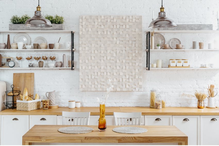 Cozy Scandi kitchen style with countertop shelves and plant on dining table