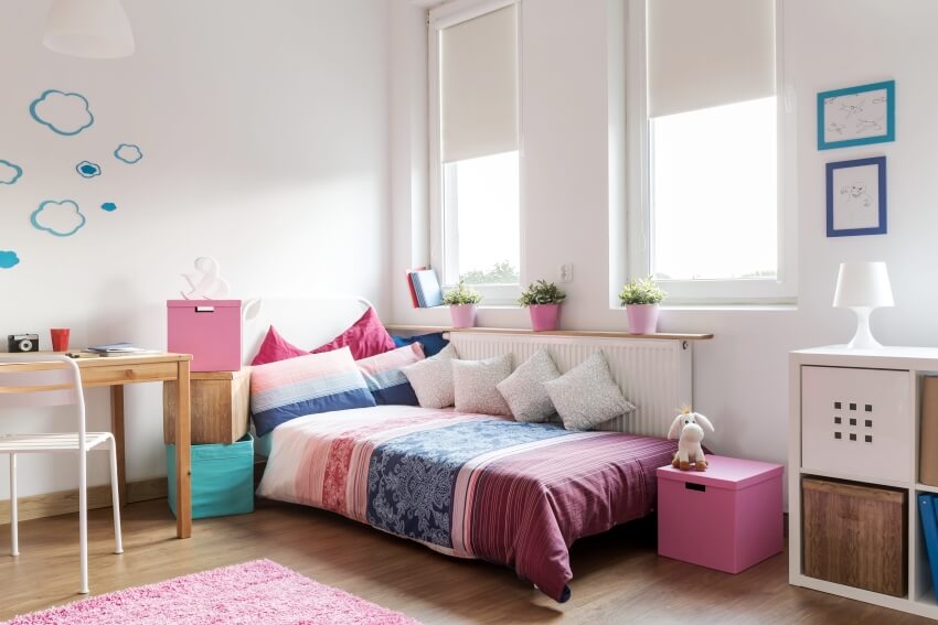 Cute homely room for teenager with pink, white and wooden accents, stackable boxes and glass windows