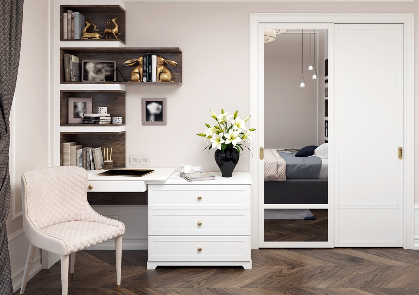 Elegant bedroom interior with white furniture, wooden floors, desk with drawers, built in closet and shelves