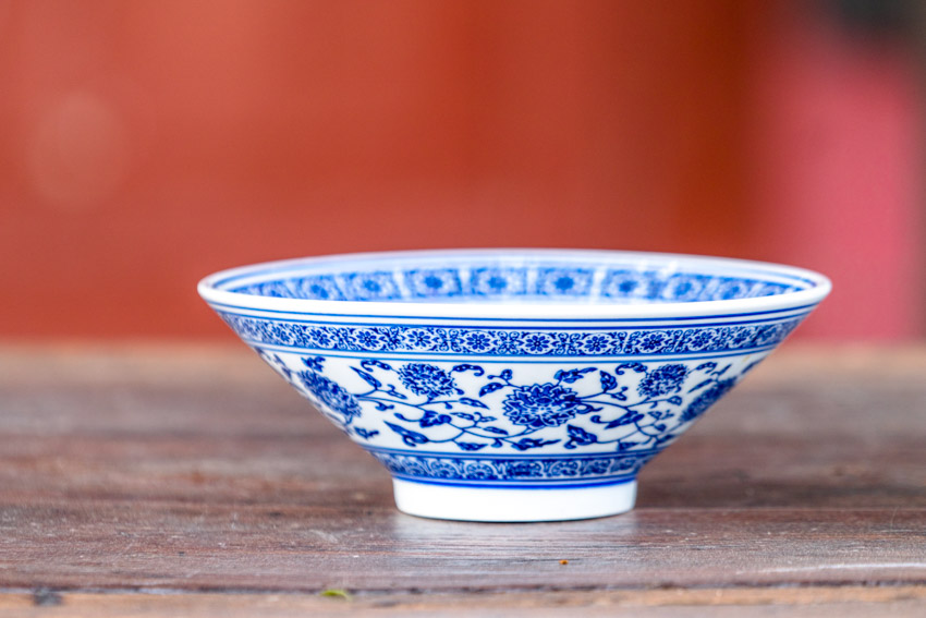 Fine china bowl on top of wood table