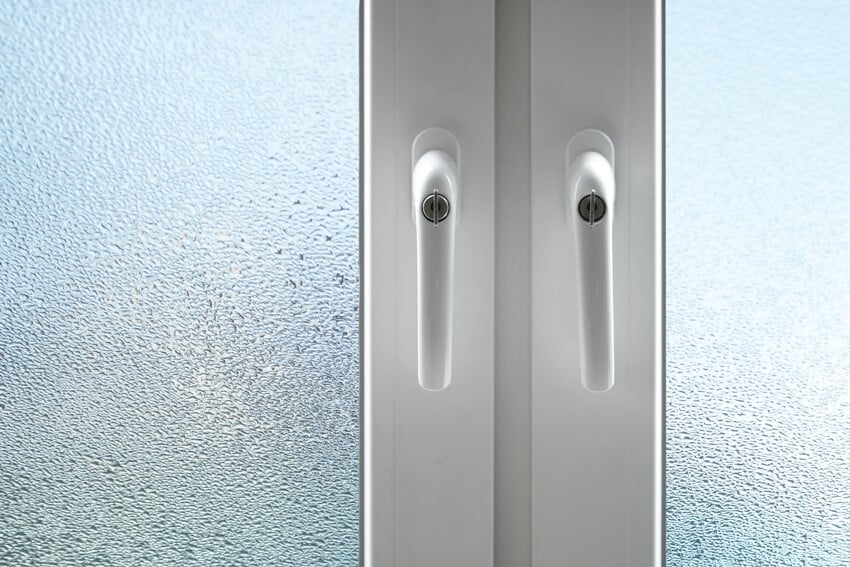 Frosted glass shower doors with white knobs