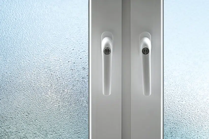 White knobs of two panel shower door