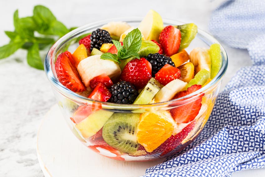 Glass bowl with different fruits inside it