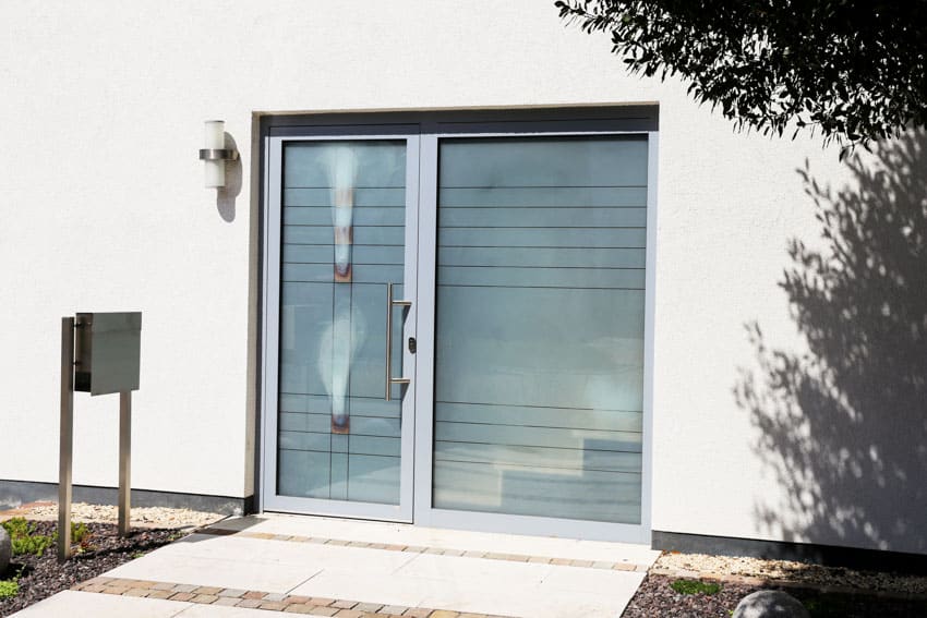 House exterior with front door and frosted glass film