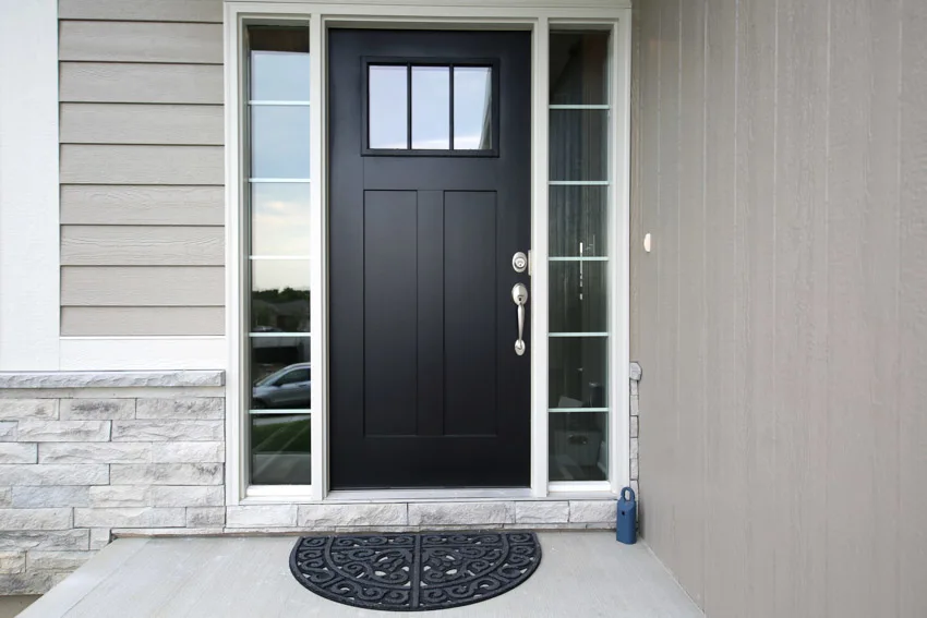 Stone wall cladding, door with sidelights and black hue