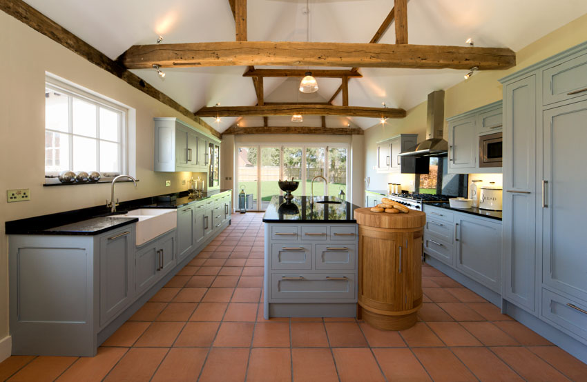 Kitchen with Mexican Saltillo floors and exposed ceiling beams