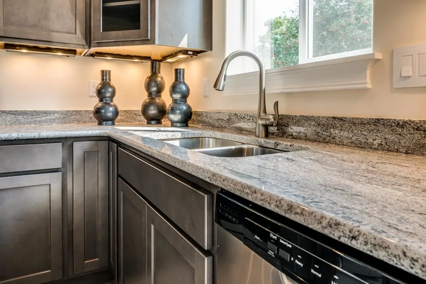Kitchen with gray granite countertops