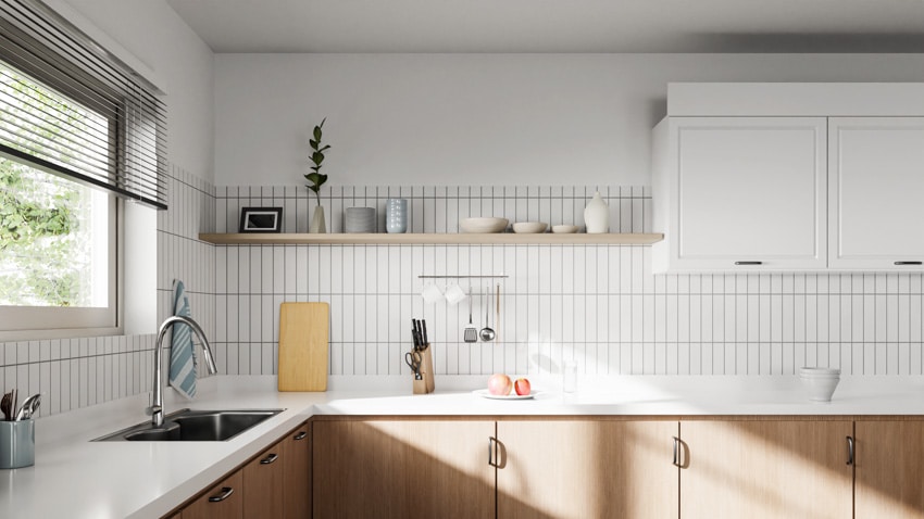 Kitchen with countertop, cabinets, vertical tile backsplash and floating shelf