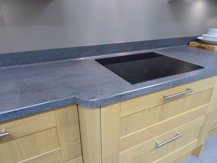 Kitchen with countertop, induction stove, and unfinished cabinets