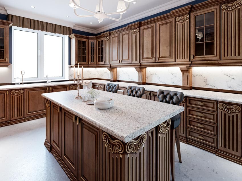 Kitchen with island, cherry cabinets, backsplash, countertops, chairs, and windows