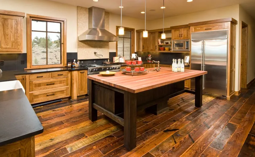 Kitchen with large cedar topped island and black soapstone