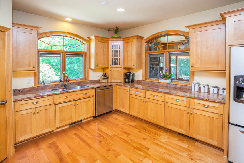 Kitchen with recessed lighting, white ceiling and wood floors