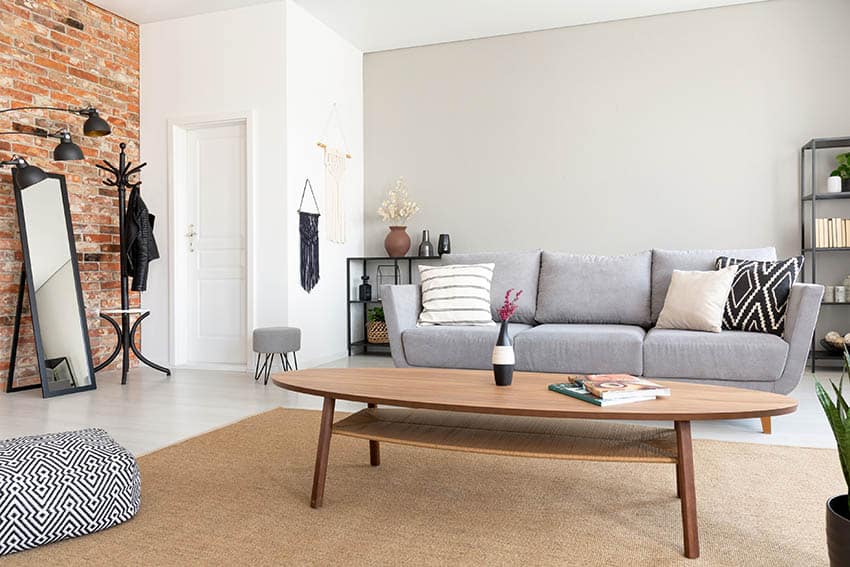 Room with gray sofa white and greige paint color walls